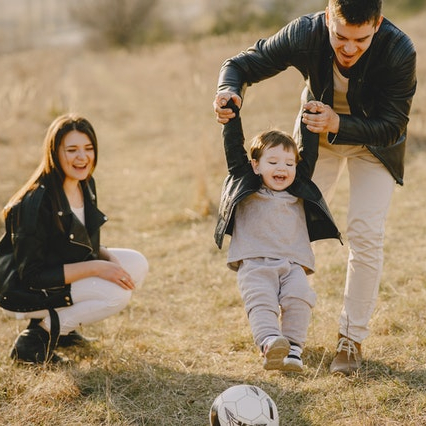 Family playing soccer